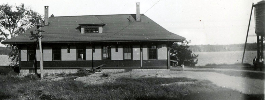  Another view of the second railroad station built at the Lakeside location in North Belgrade. In the 1950s, after Maine Central Railroad passenger service was terminated, the station was moved to the intersection of Station Road and the Oakland Road, where it was transformed into the interdenominational Faith Community Church. Today it is the North Belgrade Baptist Church.